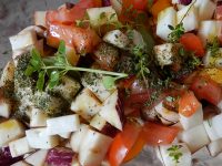 Tomato salad dressed with olive oil